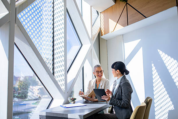 istock Female colleagues checking information on digital tablet at work 2244925010