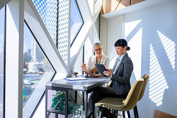 istock Female colleagues checking information on digital tablet at work 2244925025