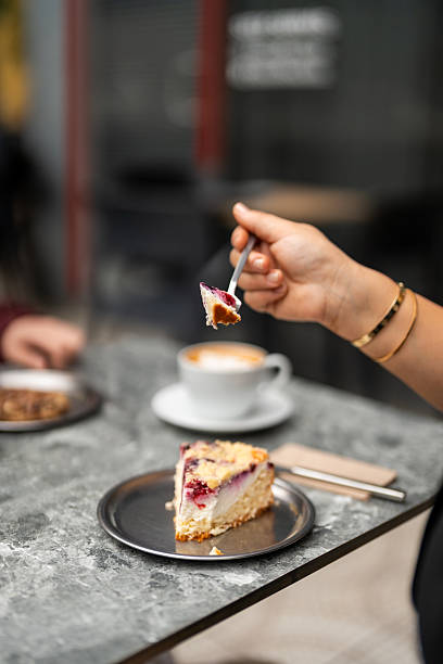istock A woman eating cheesecake. 2244929165