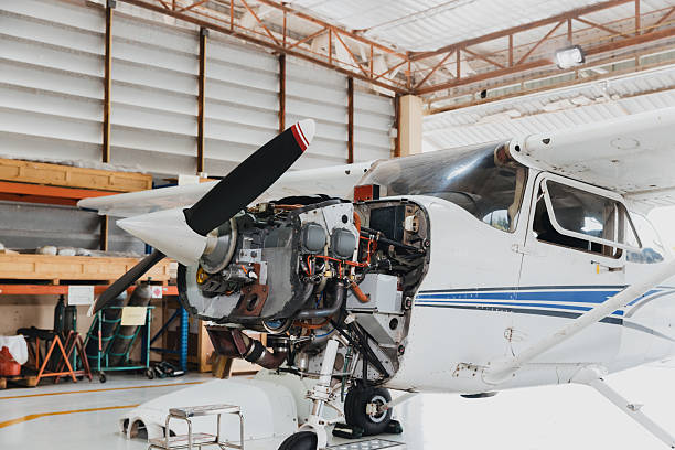 istock Aircraft engine inspection in maintenance hangar shows detailed mechanics and tools at work on a sunny day 2244930952
