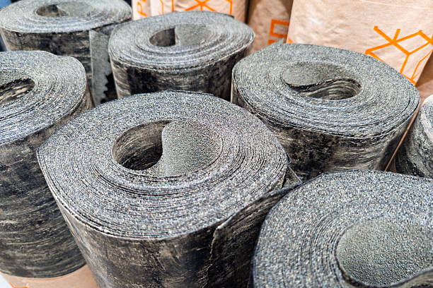 istock Rolls of black rubber material displayed in a warehouse setting during daylight hours 2244934648