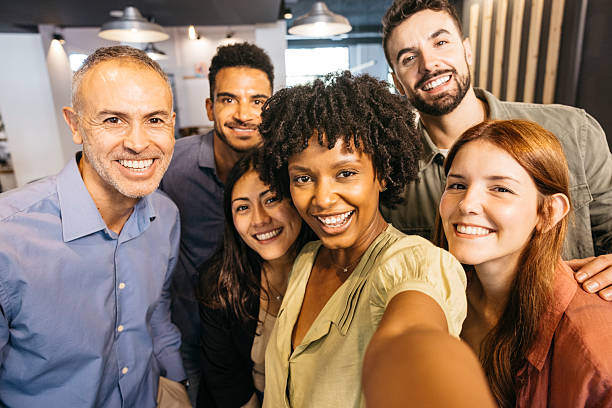 istock Diverse business team taking happy selfie in office 2244935835