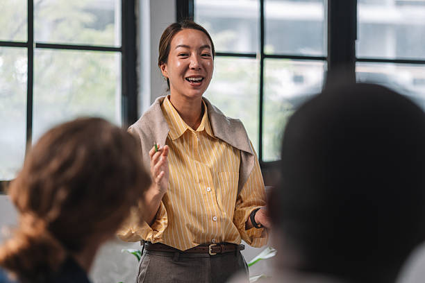 istock Woman presenting ideas in a meeting setting 2244935837