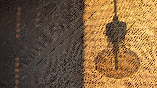 istock warm glow ambiance, cozy workshop setting with hanging bulb casting intricate shadows on wooden 2244936455