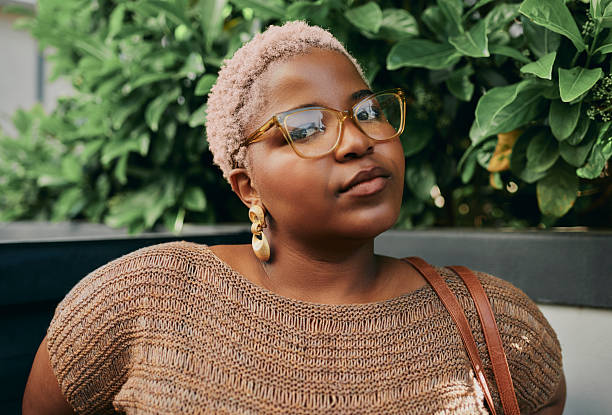 istock Young Black Creative Woman Wearing Glasses Posing Outdoors With Natural Greenery Background 2244938221