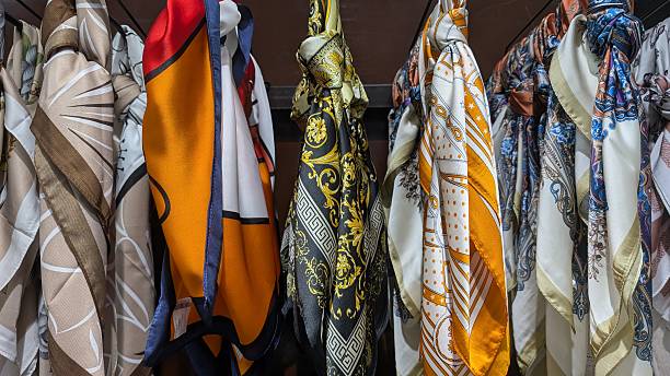 Decorative silk accessories displayed attractively, Fashionable silk scarves with detailed patterns displayed