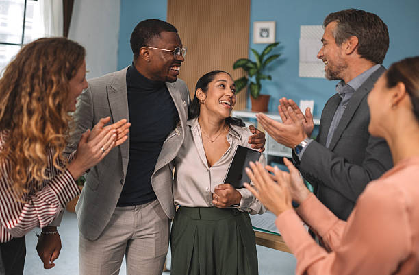istock Diverse team celebrating success together in office 2244938879