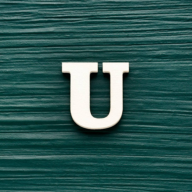 istock Capital letter U, White letter on a rustic dark green background 2244939124