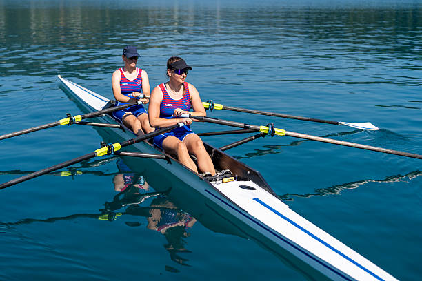 istock Energetic Young Women Rowing Across Lake in Dynamic Training Session 2244943002