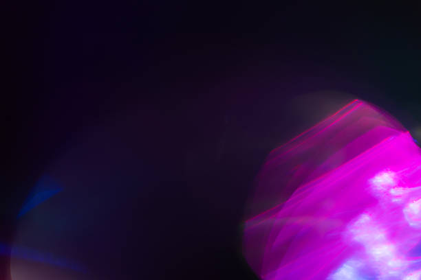istock Colorful light leak on black background, abstract design with optical lens flare shot on a long lens 2244944741