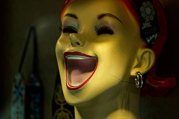 two mannequins in a shop window