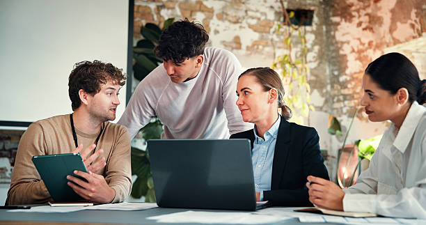 istock Meeting, tablet or marketing team with laptop in creative agency, content release schedule or agenda. Brand promotion, collaboration or people brainstorming with tech, discussion or campaign calendar 2244948360