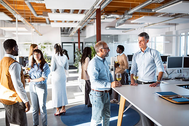istock Diverse Office Team Enjoying a Happy Hour with Wine in a Modern Workspace 2244948504