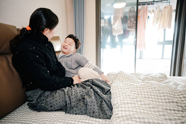 istock Asian boy and his mother at home 2244951210