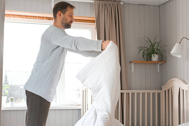 istock Mature man using metal spring chest expander pull exercises, upper body muscles, forearms and grip. Resistance Band. Wellness. 40s Male training neck and shoulder stretch at home for good posture. 2244952837