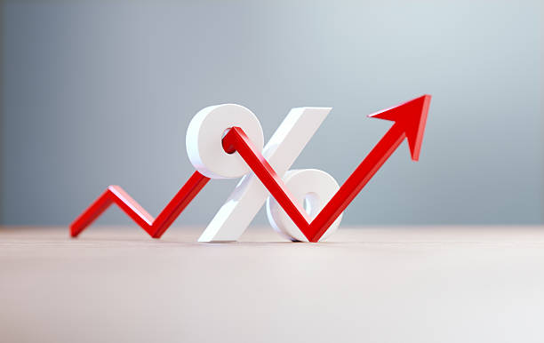 istock Red Arrow Shaped Line Graph And White Percentage Sign Before Grey Background 2244953204