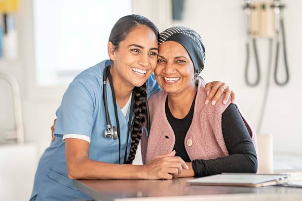 istock Caring Nurse With Elderly Patient Sharing Warm Smile In A Clinic Setting 2244953331