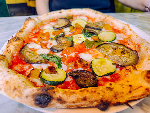 Delicious traditional Neapolitan pizza with fresh ingredients, authentic Italian cuisine baked in a stone oven representing classic Mediterranean flavor