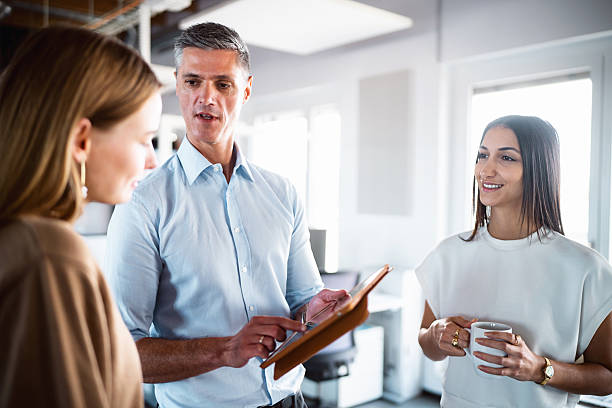 istock A Businessman Showing a work Plan on a Tablet to his Two Female Employees 2244958892