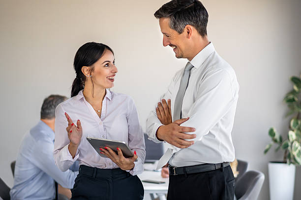 istock Business colleagues collaborating in modern office discussing ideas 2244962455