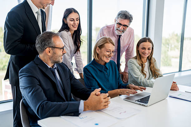 istock Business professionals collaborating at office meeting with laptop 2244962942