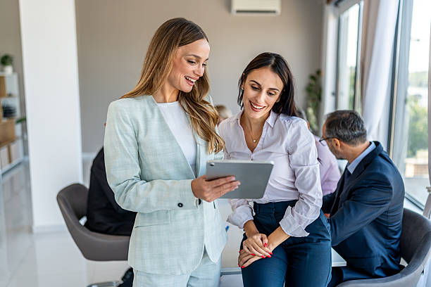 istock Businesswomen discussing project using digital tablet in office 2244963583