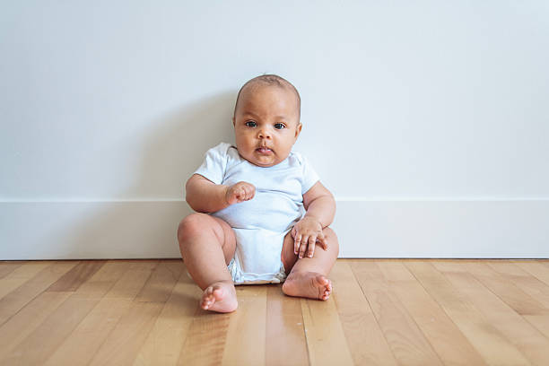 A Cheerful baby lay on floor at home