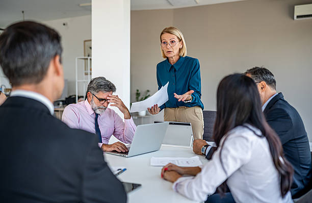 istock Stressed business team experiencing conflict during office meeting 2244965143