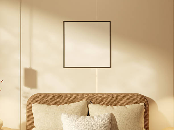 istock Light-colored poster frame on a bedroom wall with gentle sunlight and shadows. 2244967008