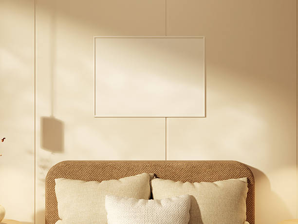 istock Neutral-toned room featuring a soft beige poster frame on a bedroom wall. 2244967012