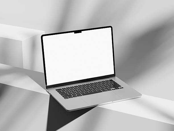 istock Minimalist laptop with soft shadows from plants around it 2244967030