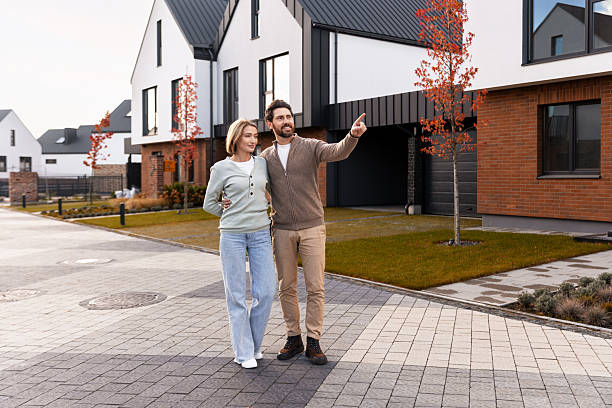 istock Couple exploring new neighborhood looking for home 2244971788