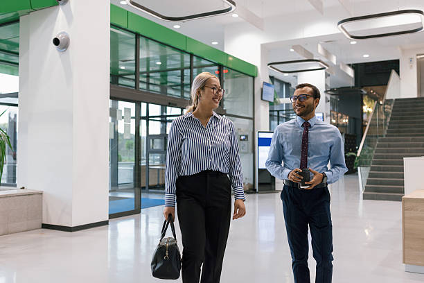 istock Diverse business colleagues entering corporate building together 2244973566