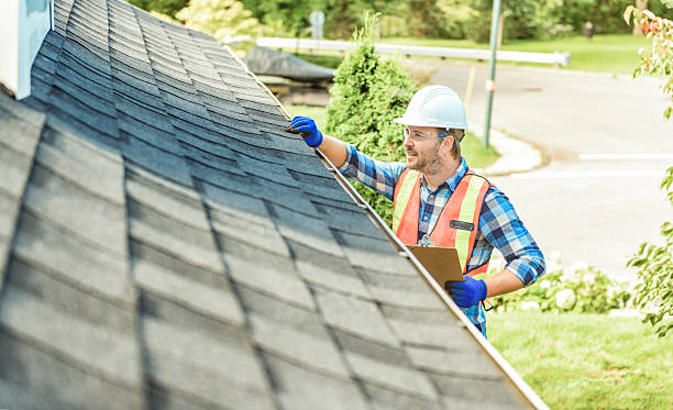 istock man with hard hat standing on steps inspecting house roof 2244973866
