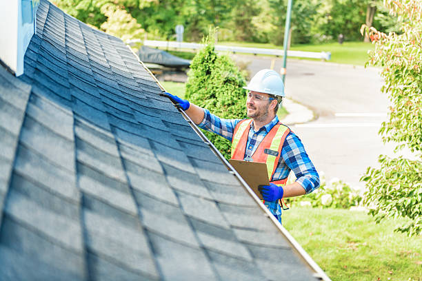 istock man with hard hat standing on steps inspecting house roof 2244973867