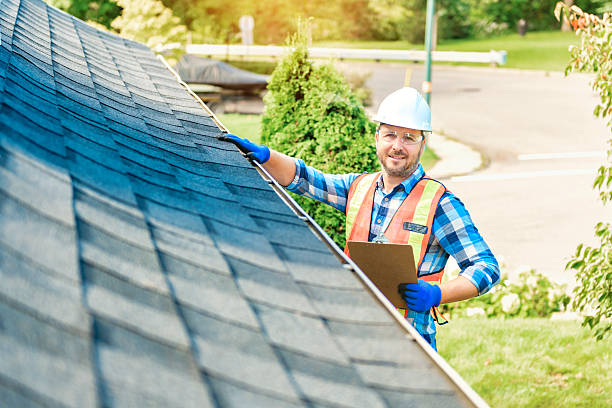 istock man with hard hat standing on steps inspecting house roof 2244973869