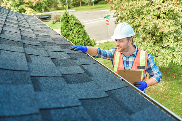 istock man with hard hat standing on steps inspecting house roof 2244973882