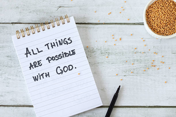 istock All things are possible with God, handwritten quote in a notebook with mustard seeds 2244975081
