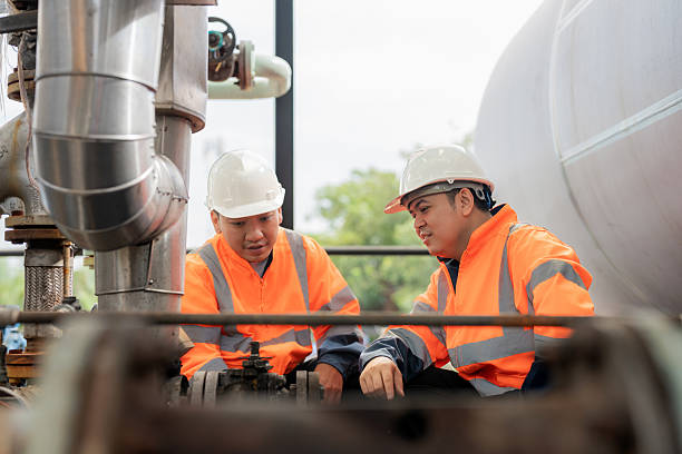 istock A senior engineer at an oil refinery explains the function of a circulation pump system to a junior technician. Concept of engineering, lubricant production, manufacturing, oil industry, refinery, and technology in the energy sector. 2244976299