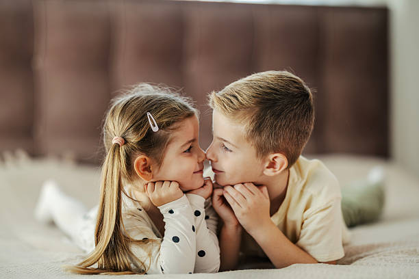 istock Children siblings connecting on bed showing love and affection 2244982867