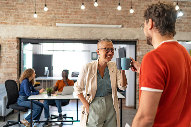 istock Diverse business people toasting coffee during office break 2244983891