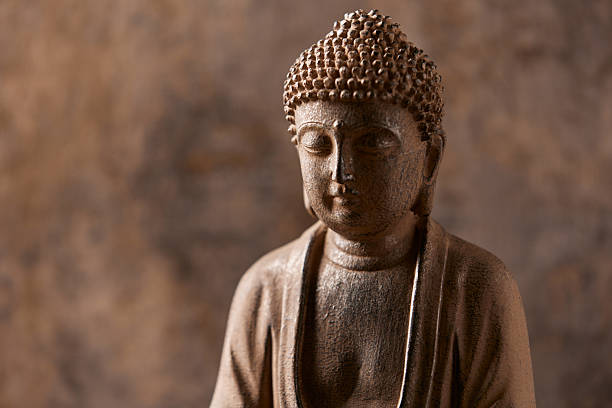 istock Meditating Buddha Statue on dark background. Soft focus. Close up. Copy space. 2244984188