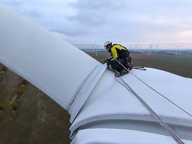 istock Wind Turbine Technician Performing Blade Inspection at Extreme Height 2244984301