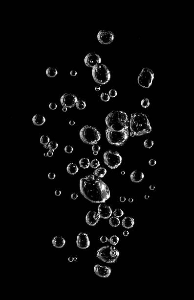 istock Clear water bubbles rising on black background captured in macro photography, symbolizing purity, freshness, and clarity. Perfect for clean design, science, beverage ads, and modern abstract visuals. 2244984967