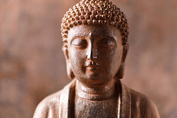 istock Meditating Buddha Statue on dark background. Soft focus. Close up. Copy space. 2244985043