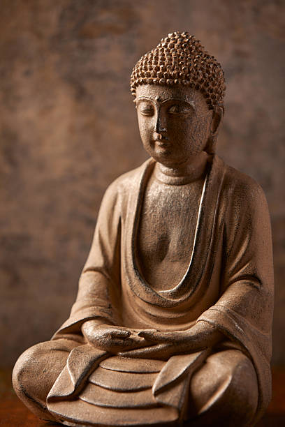 istock Meditating Buddha Statue on dark background. Soft focus. Close up. Copy space. 2244985071
