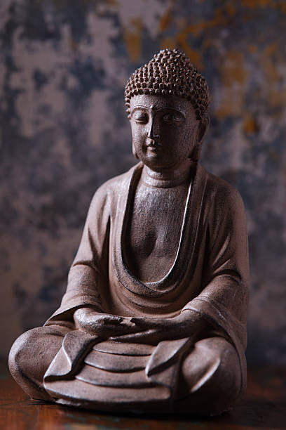 istock Meditating Buddha Statue on dark background. Soft focus. Close up. Copy space. 2244985082