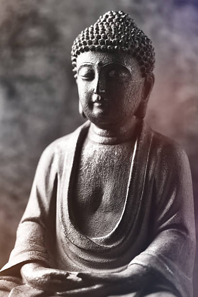 istock Meditating Buddha Statue on dark background. Soft focus. Close up. Copy space. 2244985083