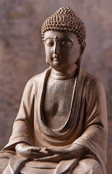istock Meditating Buddha Statue on dark background. Soft focus. Close up. Copy space. 2244985110