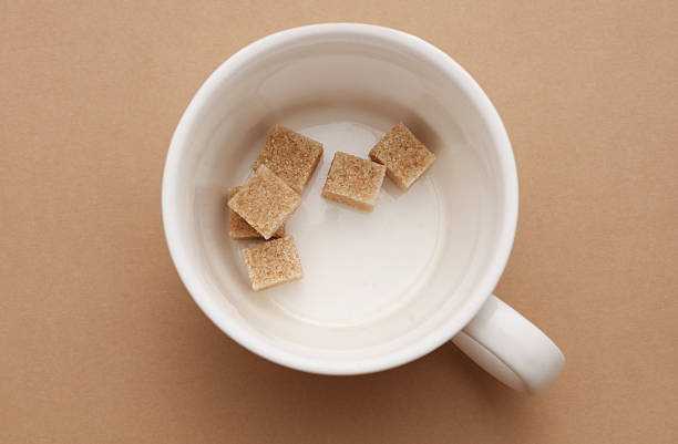Yellow coffee cup with sweetener